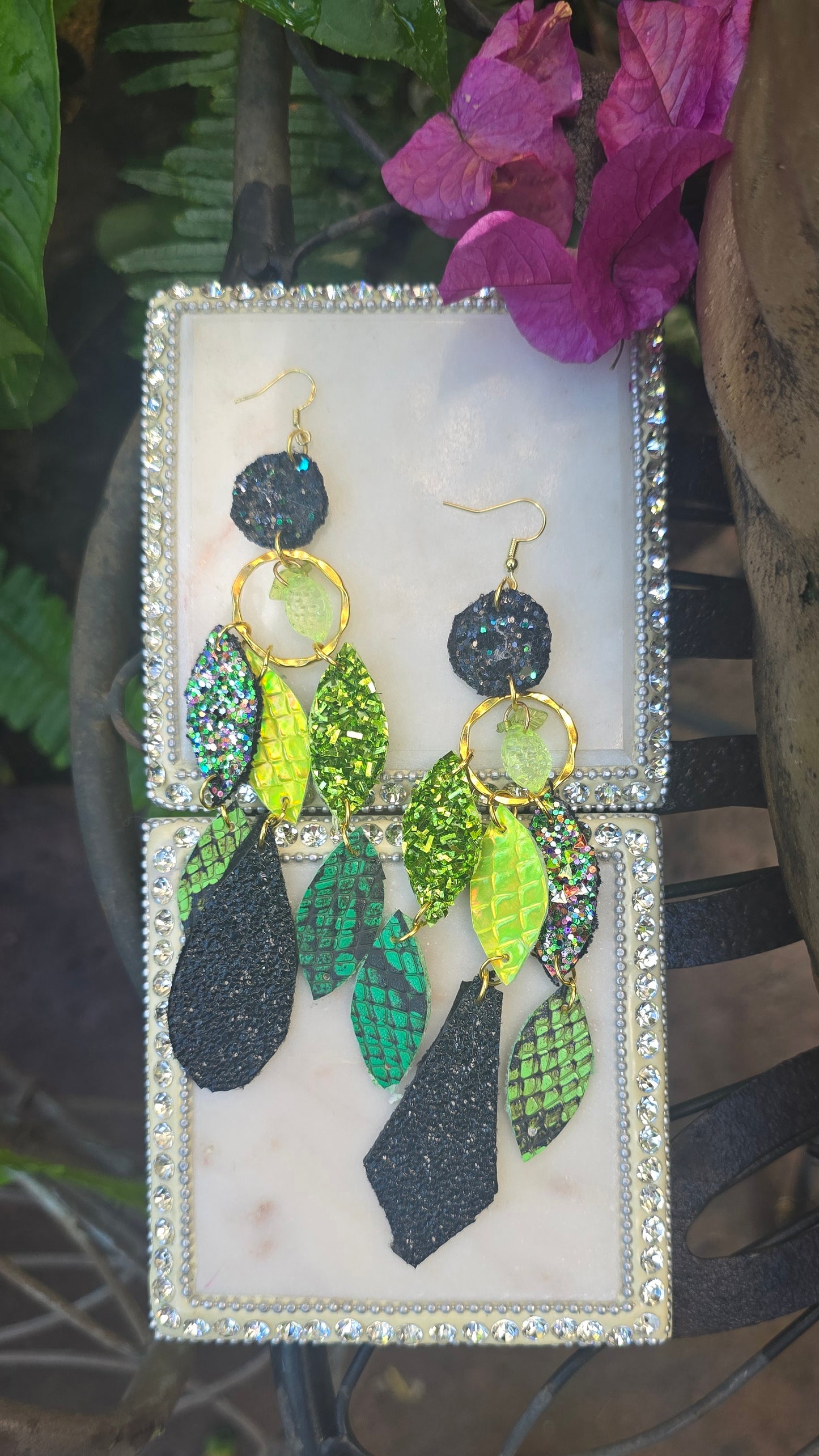 Green geometric dangle earrings from the Shannon collection by Shop Moxxc featuring modern design and intricate shapes.