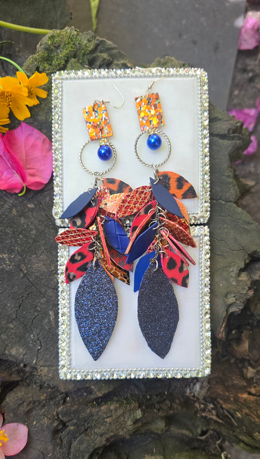 Blue and orange teardrop chandelier earrings featuring the Mikayla design by Shop Moxxc, with intricate detailing and vibrant colors.