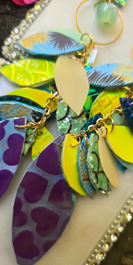 Purple pastel teardrop chandelier earrings featuring a delicate design, from Shop Moxxc, displayed on a clean background.