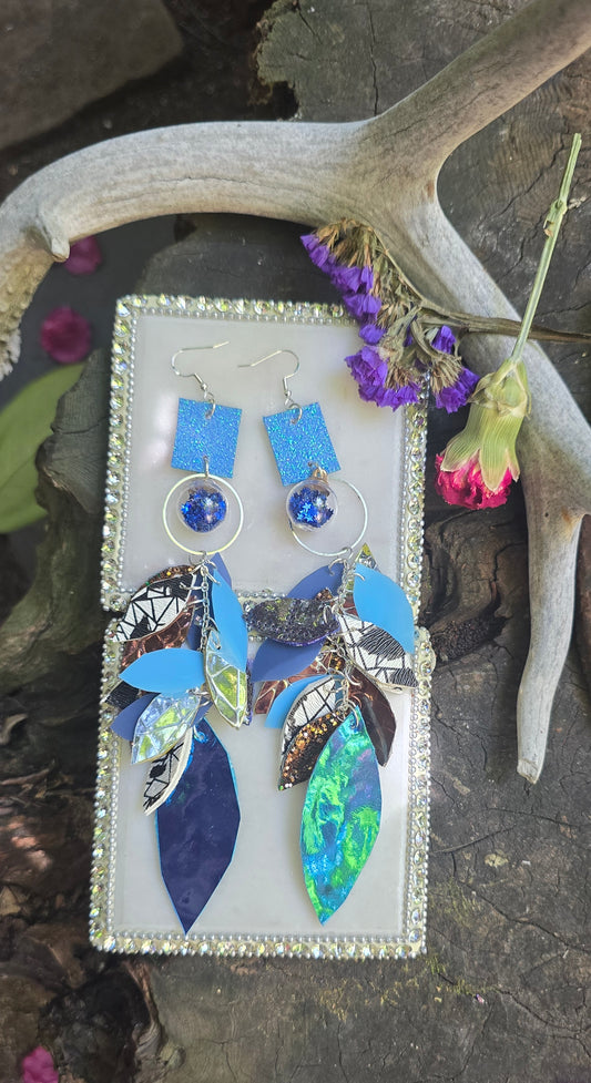 Blue long teardrop chandelier earrings with intricate design from Shop Moxxc, featuring elegant gold-tone detailing and dangle style.