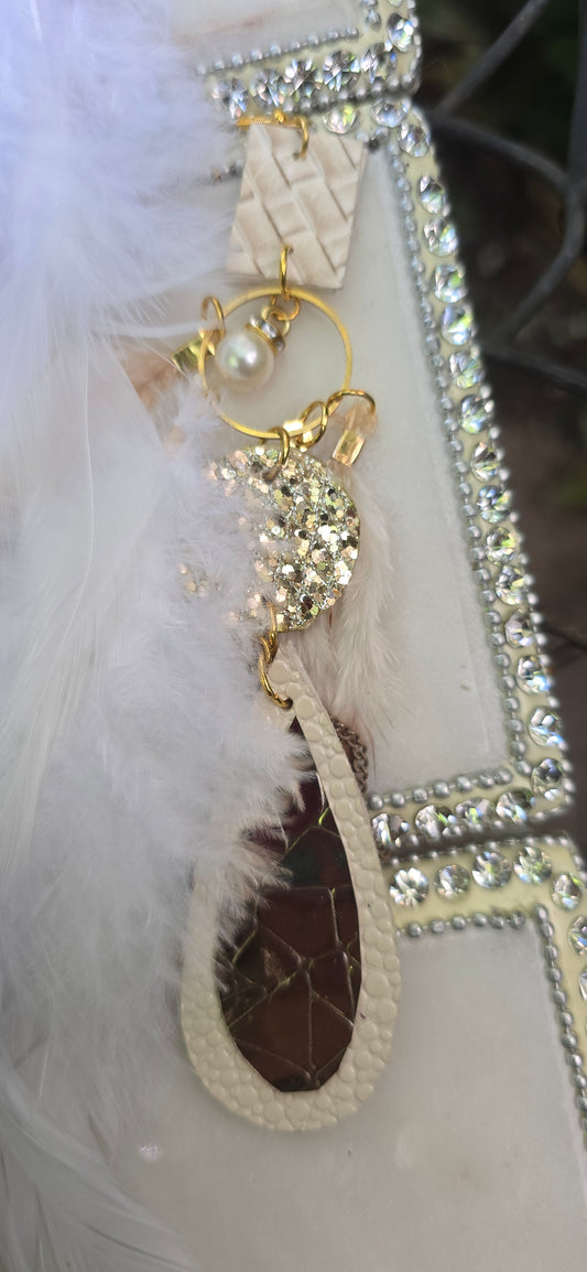 White long feather earrings by Shop Moxxc featuring elegant feather design and lightweight dangle style.