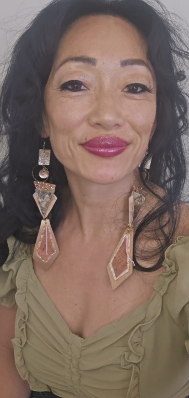 Neutral long geometric dangle earrings by Shop Moxxc featuring a modern design and elegant shapes.
