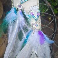 White boho festival feather earrings by Alyssa, featuring delicate feathers and intricate design perfect for a stylish look.