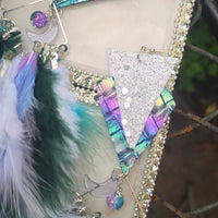 White boho festival feather earrings by Alyssa, featuring delicate feathers and intricate design perfect for a stylish look.