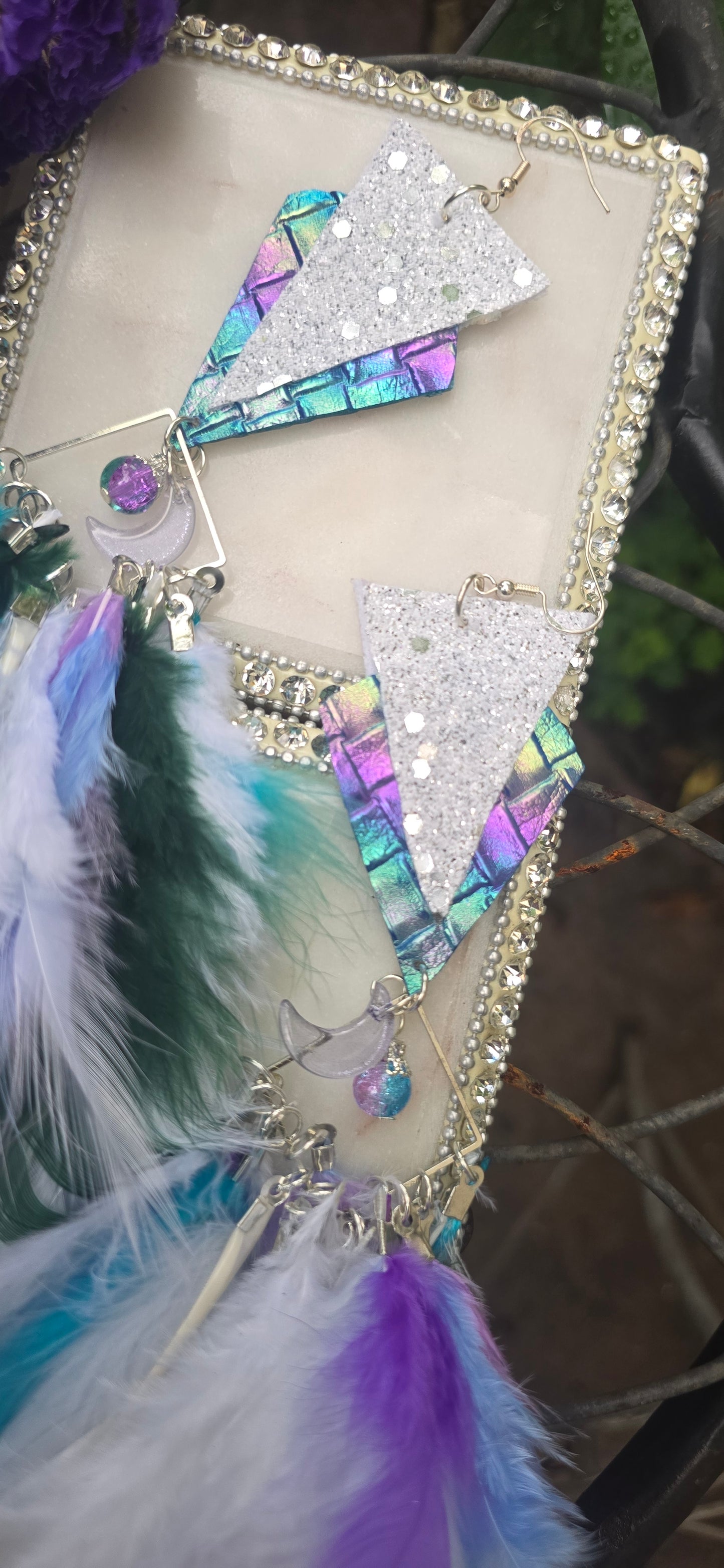 White boho festival feather earrings by Alyssa, featuring delicate feathers and intricate design perfect for a stylish look.
