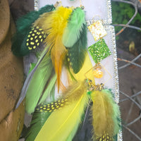 Green boho festival feather earrings by Shop Moxxc, showcasing vibrant feathers and a stylish design.