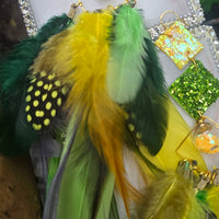 Green boho festival feather earrings by Shop Moxxc, featuring vibrant feathers and intricate detailing for a stylish look.