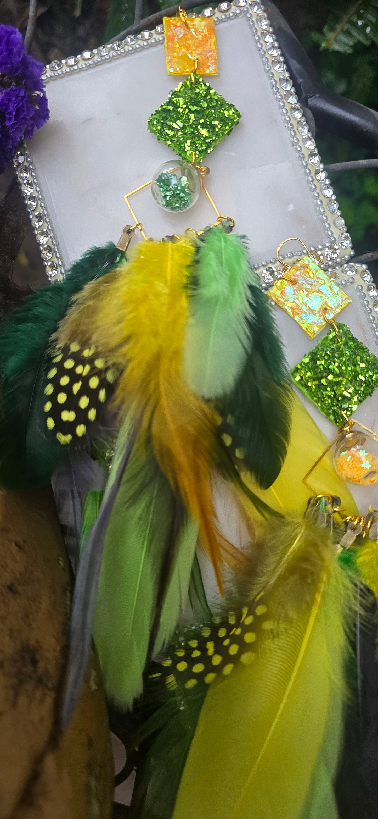 Green boho festival feather earrings by Shop Moxxc, featuring vibrant feathers and intricate detailing for a stylish look.