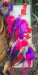 Pink boho festival feather earrings from Shop Moxxc, featuring colorful feathers and intricate design details.