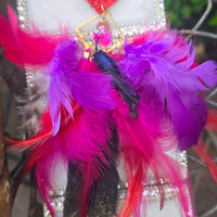 Pink boho festival feather earrings by Shop Moxxc, featuring vibrant feathers and a stylish, dangling design.