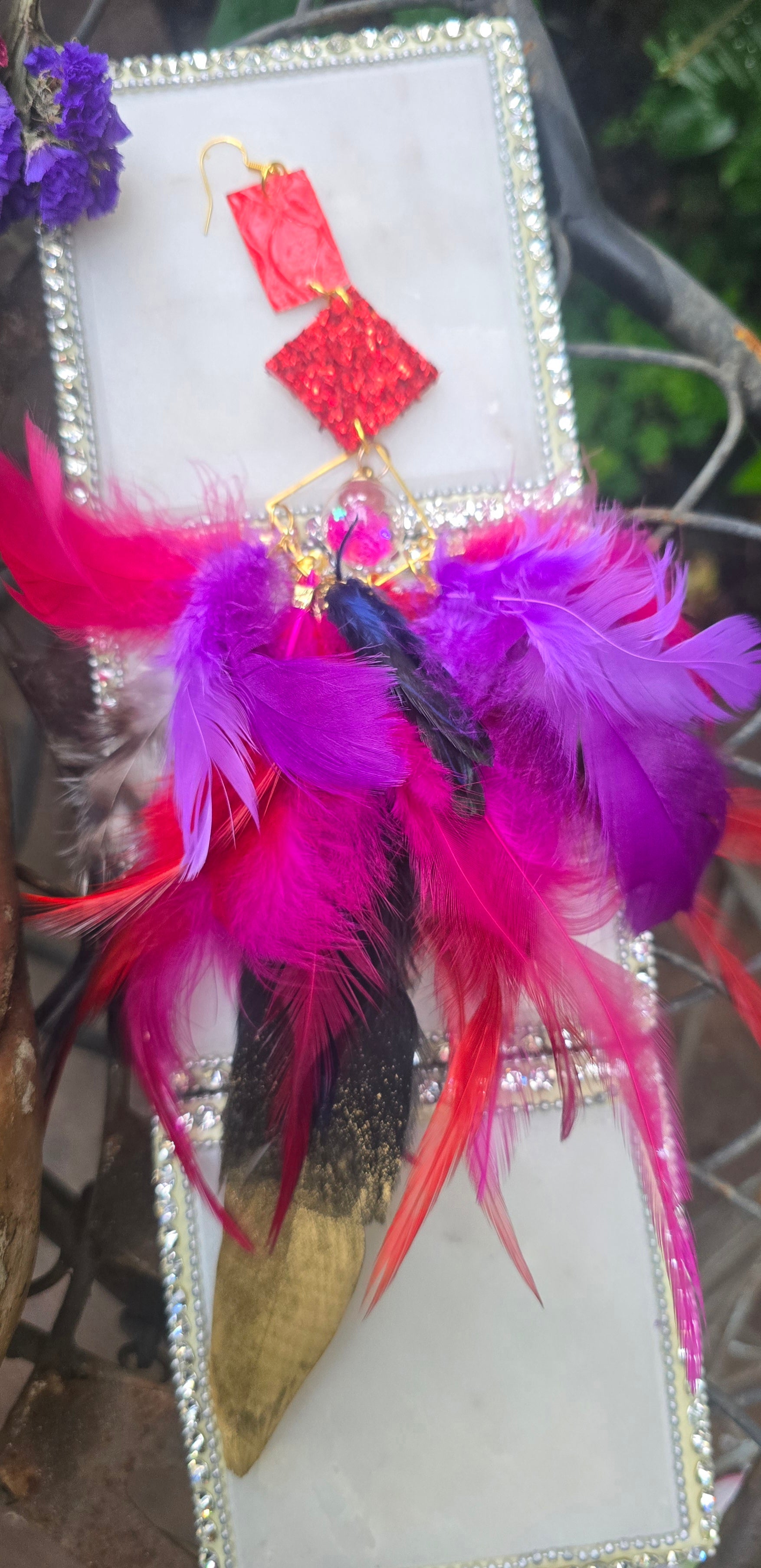 Pink boho festival feather earrings by Shop Moxxc, featuring vibrant feathers and a stylish, dangling design.