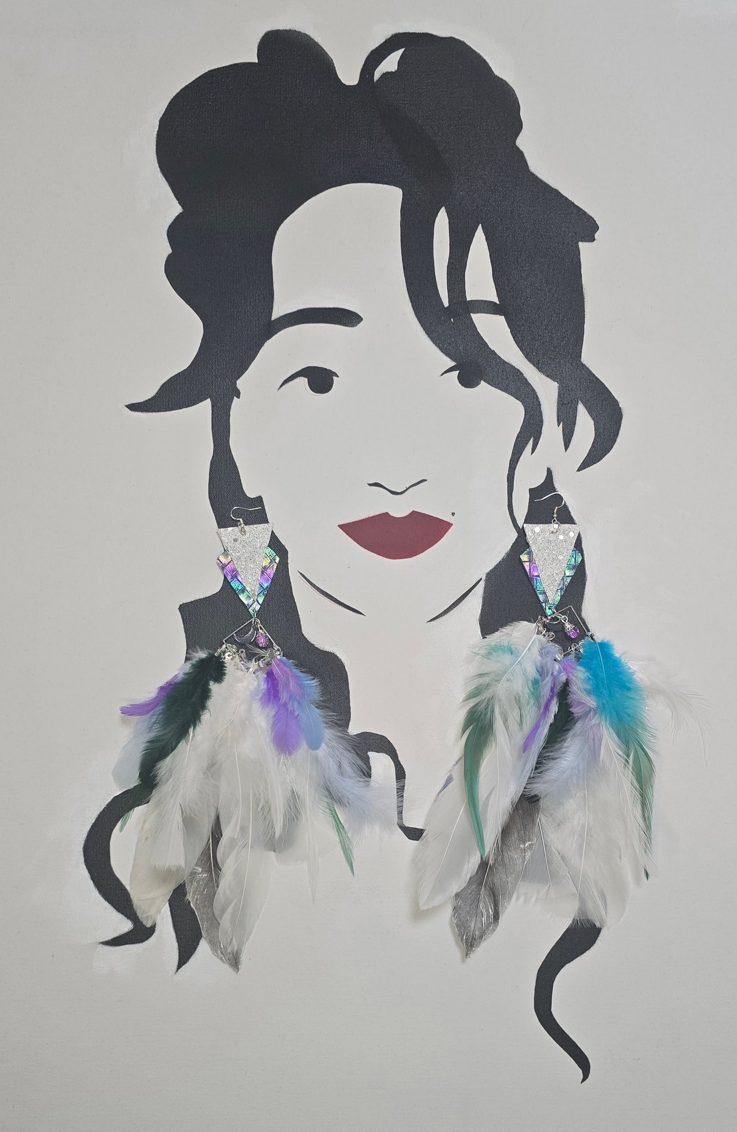 White boho festival feather earrings by Shop Moxxc, featuring delicate feathers and intricate design for a stylish look.