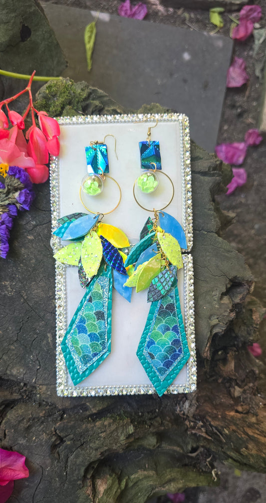 Blue and yellow teardrop chandelier earrings featuring elegant design and gold hooks, crafted by Shop Moxxc.