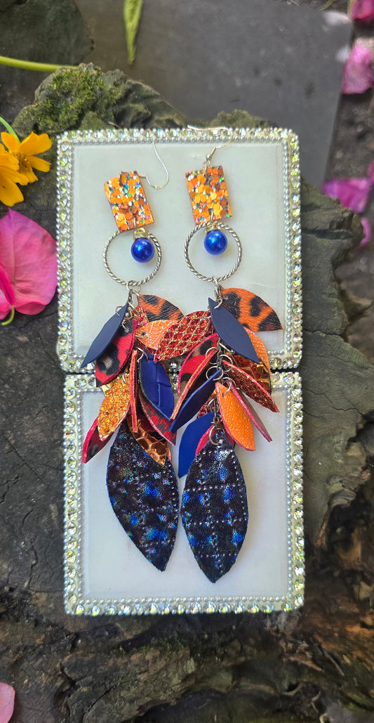 Blue and orange teardrop chandelier earrings featuring the Mikayla design by Shop Moxxc, with intricate detailing and vibrant colors.