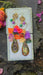 Multicolored gold layered statement earrings by Shop Moxxc featuring vibrant, overlapping gold and multicolor design.