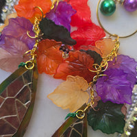 Multicolored gold layered statement earrings by Shop Moxxc, featuring vibrant, intricate design for bold fashion accents.
