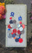Red and blue sparkly round dangle earrings from Shop Moxxc, featuring a shiny, festive design with sparkling embellishments.