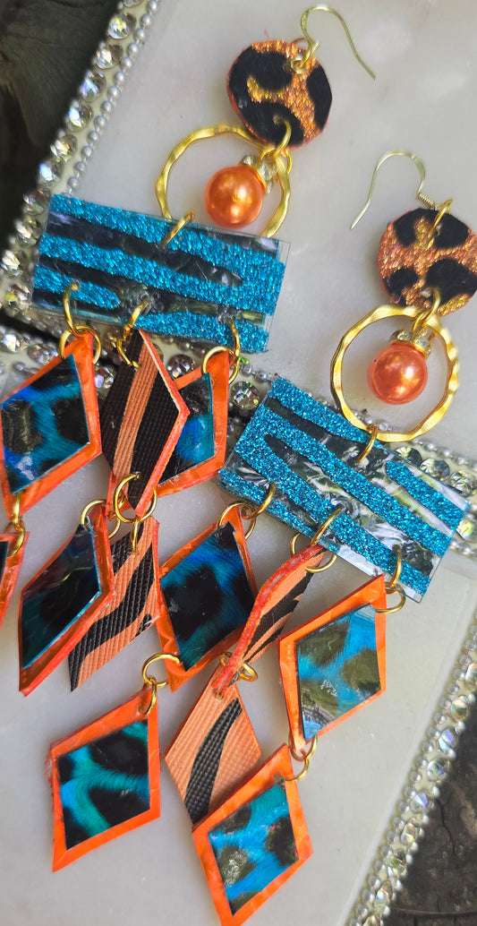 Orange geometric fringe earrings featuring bold fringe and modern design from Shop Moxxc's Holly collection.