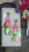 Bright multicolored layered earrings from Shop Moxxc featuring vibrant, dangling jewelry with various colorful geometric shapes.