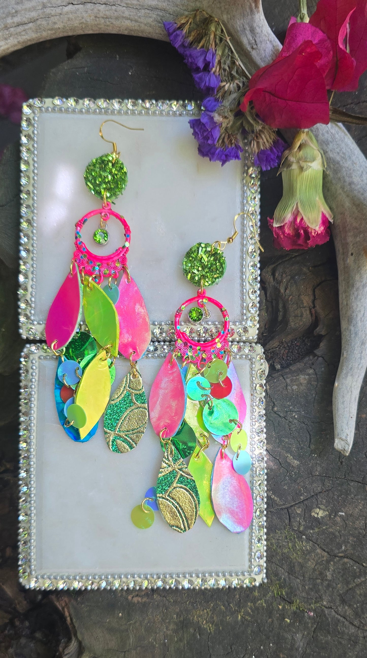 Bright multicolored layered earrings from Shop Moxxc featuring vibrant, dangling jewelry with various colorful geometric shapes.