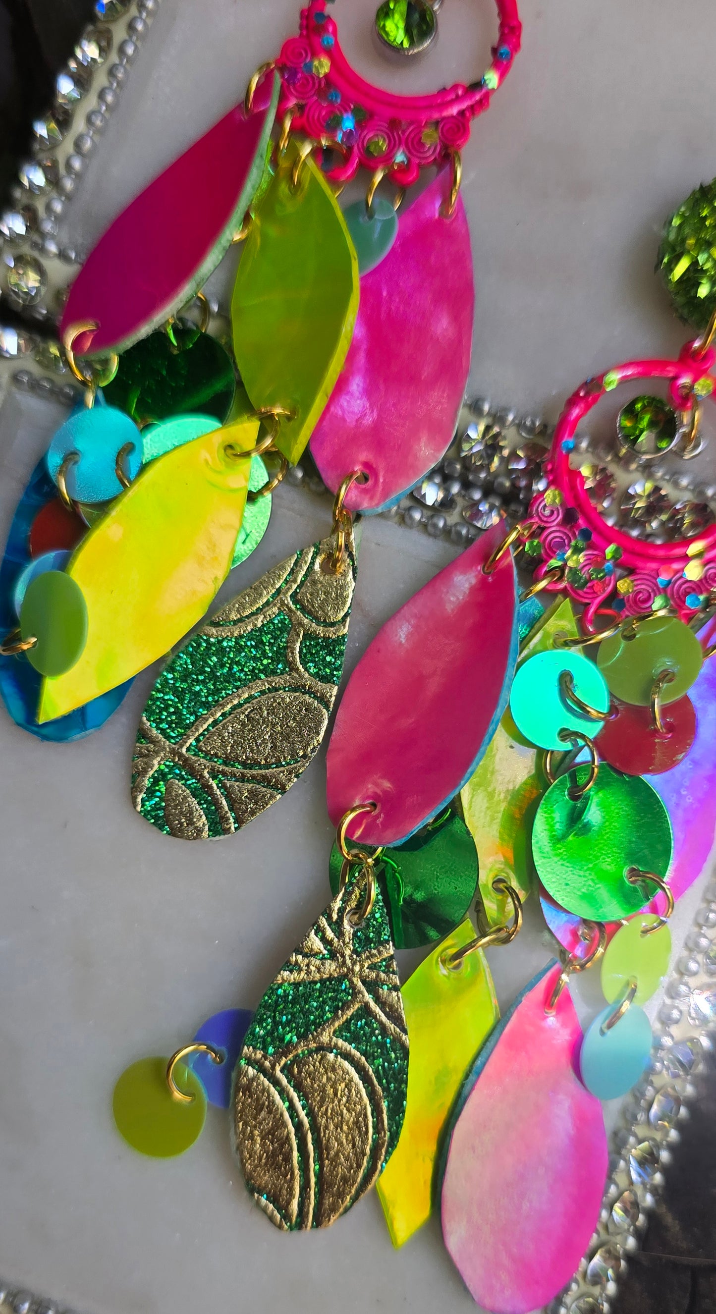 Bright multicolored layered earrings named Kathy from Shop Moxxc, featuring vibrant, overlapping designs perfect for statement jewelry.
