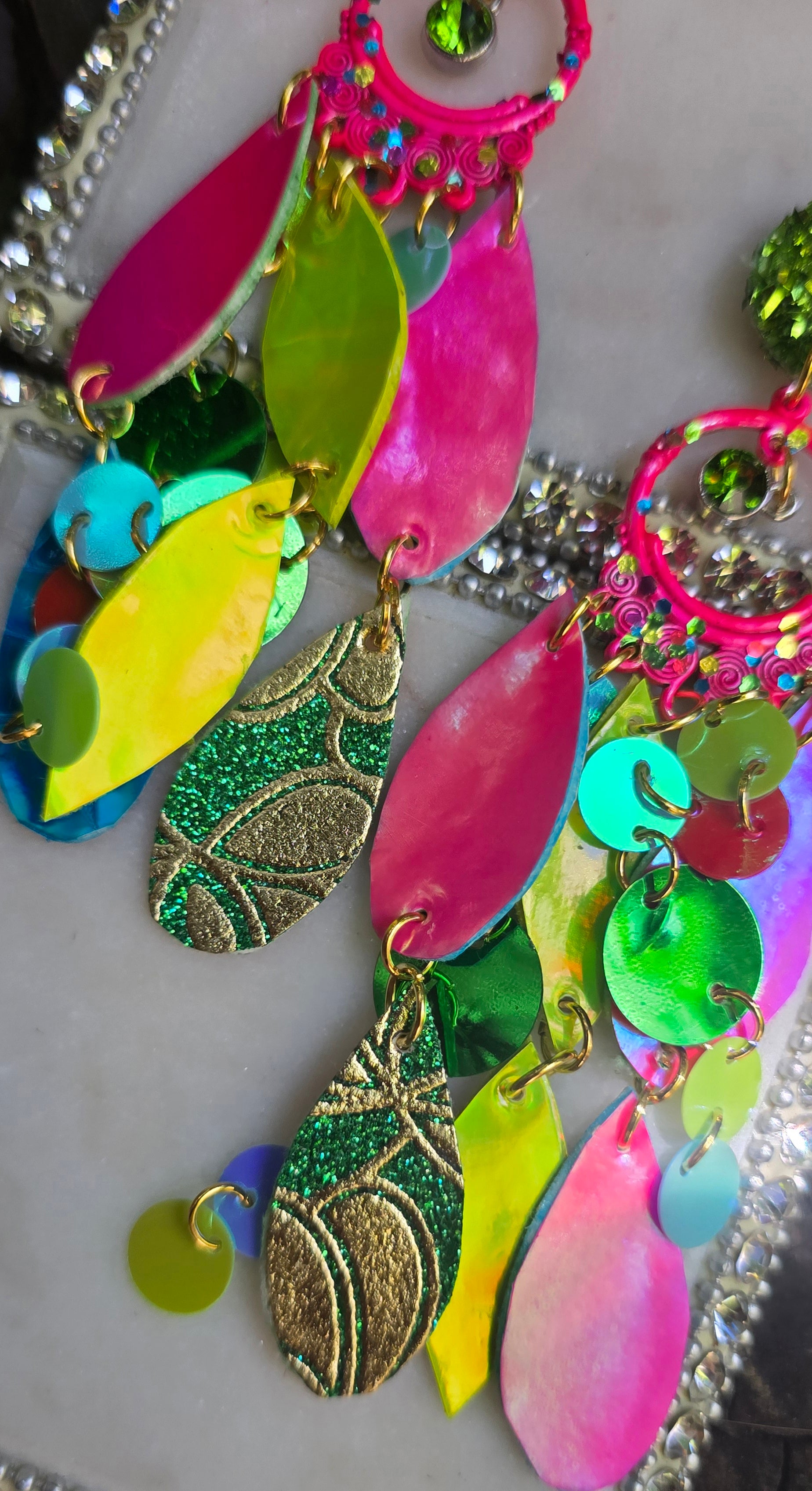 Bright multicolored layered earrings named Kathy from Shop Moxxc, featuring vibrant, overlapping designs perfect for statement jewelry.