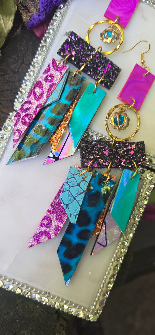 Multicolored hot pink fringe earrings from Shop Moxxc Stella collection, featuring vibrant layered tassels and bold style.