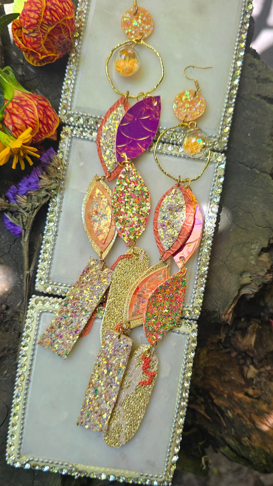 Angelica yellow long statement earrings by Shop Moxxc featuring bold, dangling design with intricate details and vibrant color.