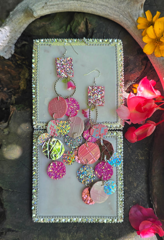 Pink glittery round dangle earrings from Shop Moxxc's Tanya collection, featuring sparkling pink glitter and silver hooks.