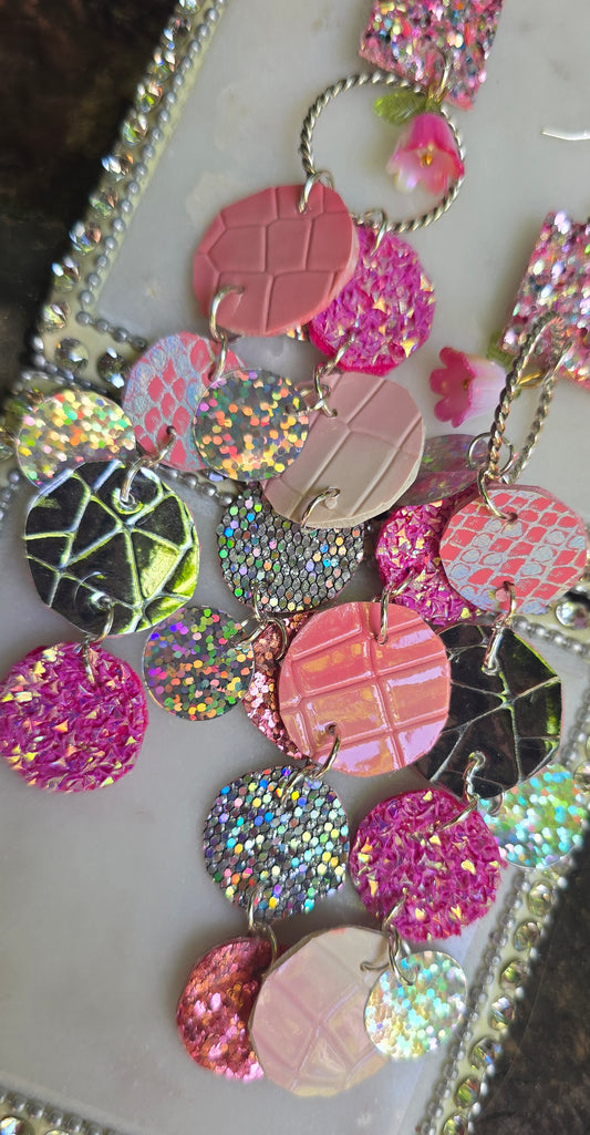 Pink glittery round dangle earrings from Shop Moxxc's Tanya collection, featuring sparkling pink glitter and silver hooks.