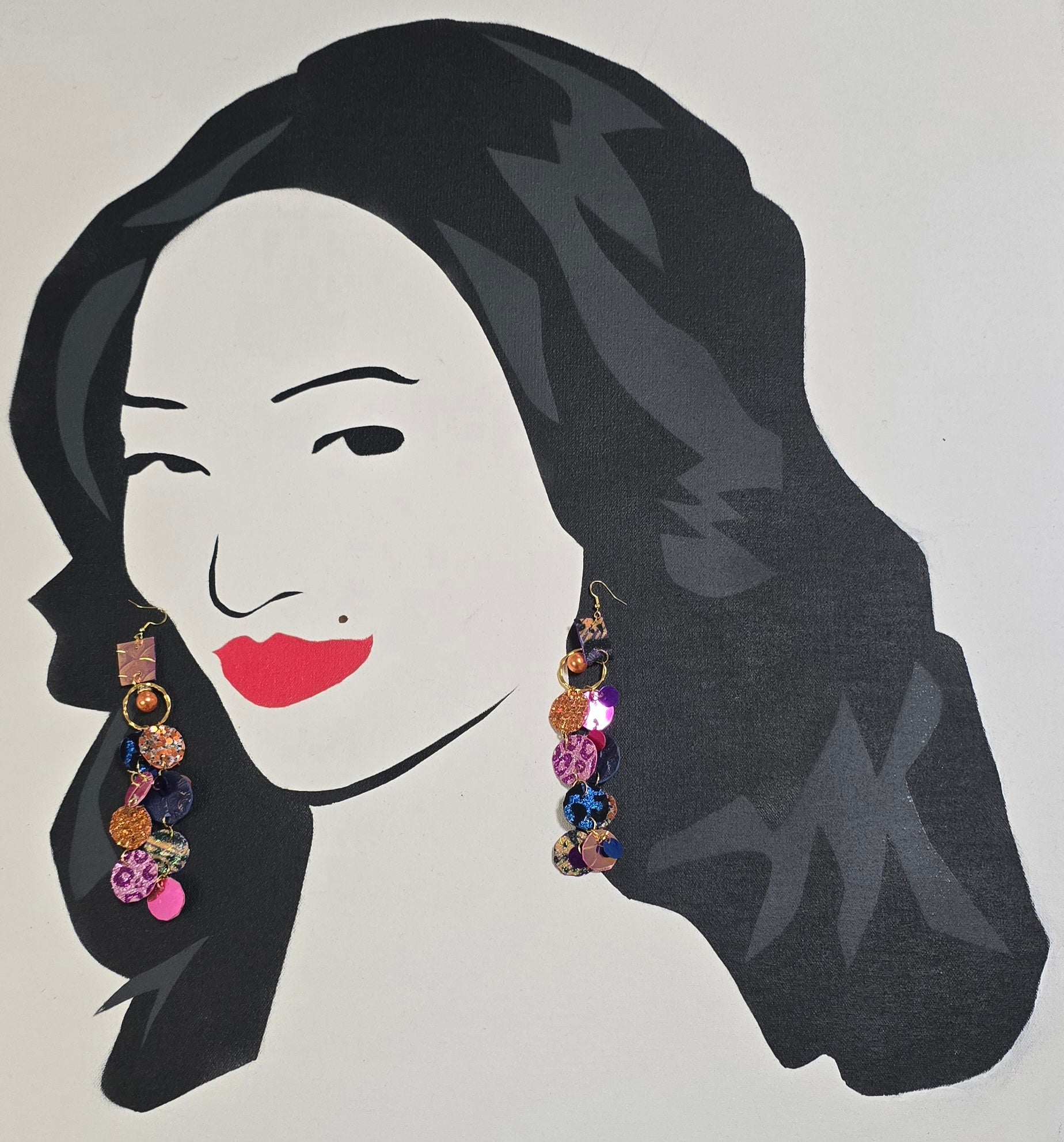Multicolored round dangle earrings in orange by Ivonne, featuring vibrant, circular design with gold hooks.