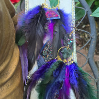 Dark blue feather earrings named Helen, featuring lightweight feather design with silver hooks, from Shop Moxxc.