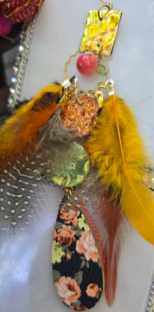 Virginia yellow flower feather earrings by Shop Moxxc, featuring vibrant yellow flower and feather design in silver-tone metal.