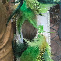 Green feather boho earrings with gold accents, featuring a lightweight, dangling design perfect for casual or bohemian styles.