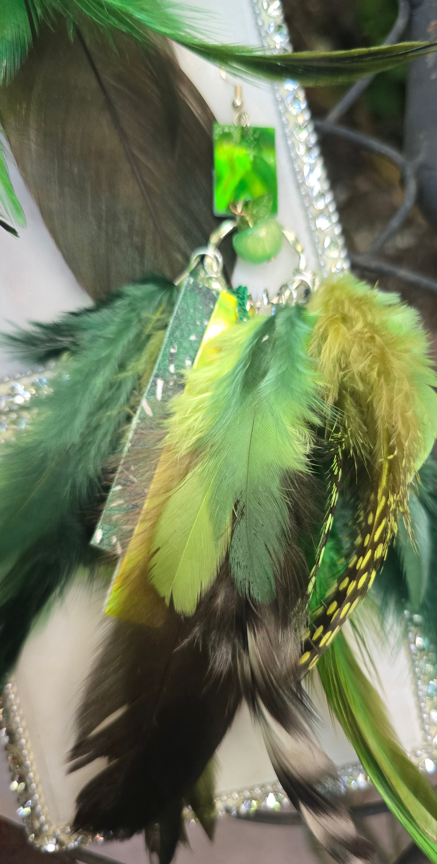 Green feather boho earrings featuring layered feather design, stylish and lightweight, from Shop Moxxc's Alexa collection.