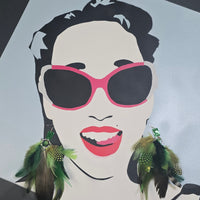 Green feather boho earrings with gold accents, featuring layered feather design and dangle style from Shop Moxxc.
