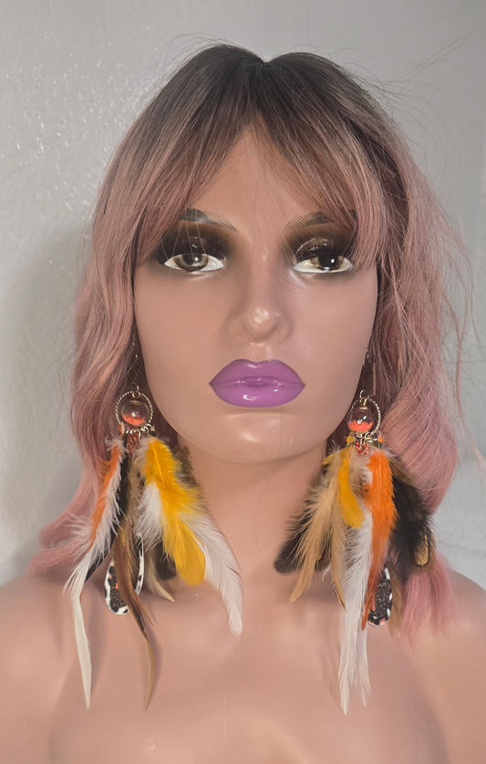 Kimberly orange animal print feather earrings with gold hooks, featuring bold feather and animal print design for a stylish look.