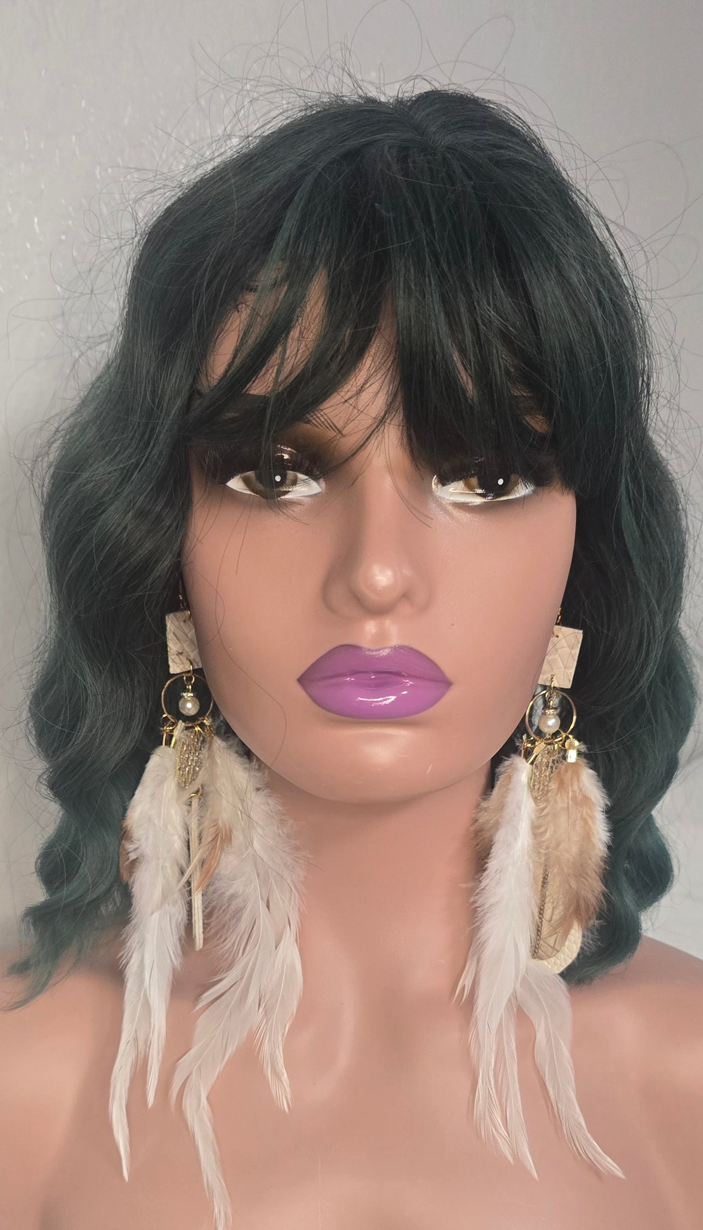 Leah white long feather earrings by Shop Moxxc hanging from ears, featuring delicate feather details and elegant design.