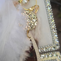 Leah white long feather earrings by Shop Moxxc with delicate feather details and gold hooks for a stylish, boho-inspired look.